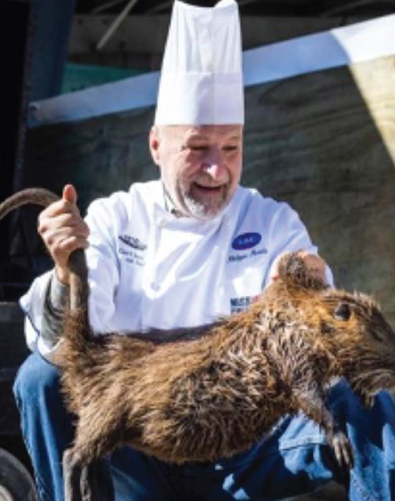 Chef Philippe with nutria, photographed in his book